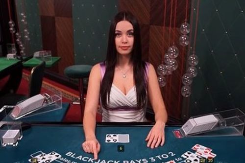 Anastacia is a live dealer at blackjack. 